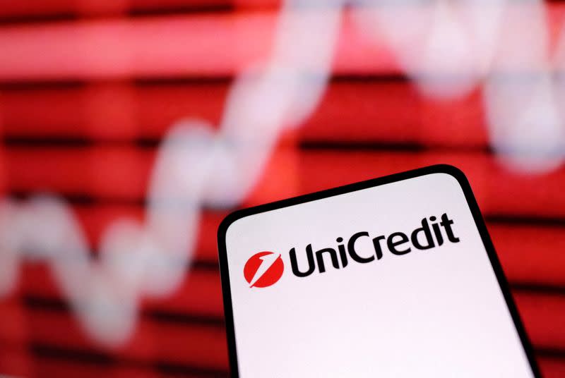 FILE PHOTO: Illustration shows Unicredit bank logo and rising stock graph