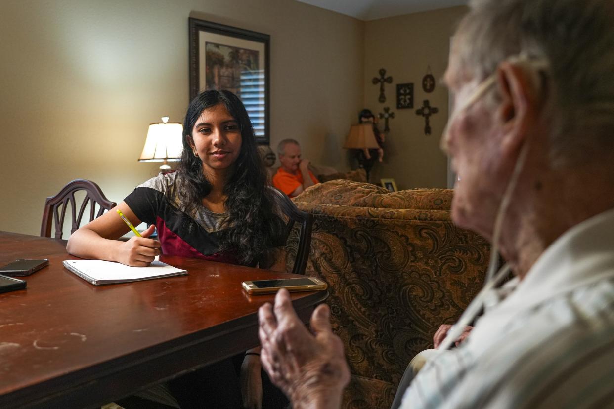 University of Texas student Neelanjana Chakrabarty interviews Bob Bell, 92, in his North Austin home as part of the Last Writers project, which will produce a book about him for his family.