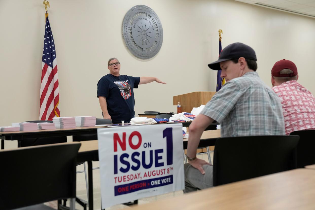 Jul 8, 2023; Columbus, Ohio, USA;  Central Ohio Labor Council organizer Jamie Shumaker directs volunteers gathered at the International Brotherhood of Electrical Workers 683 union hall to write postcards and pick up shirts and yard signs before going out and knocking doors to encourage people to vote against Issue 1 in the August special election.