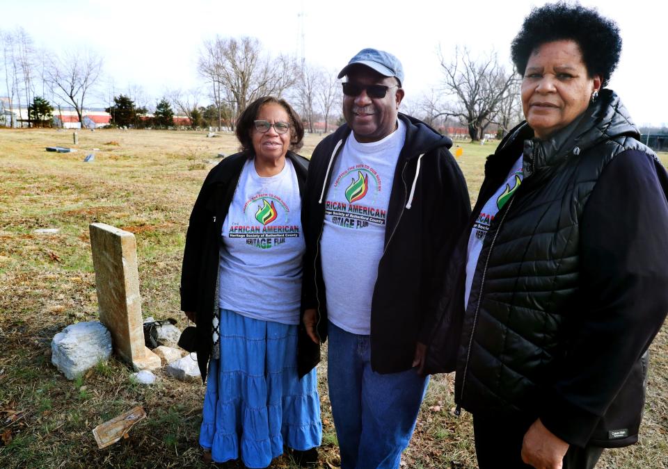 Members of the African American Heritage Society of Rutherford County left to right Secretary Margaret McKinley,  Vice President Billy McKinley and President Mary Watkins stand in the Benevolent Cemetery in Murfreesboro, Tenn., on Tuesday, Jan. 25, 2022.