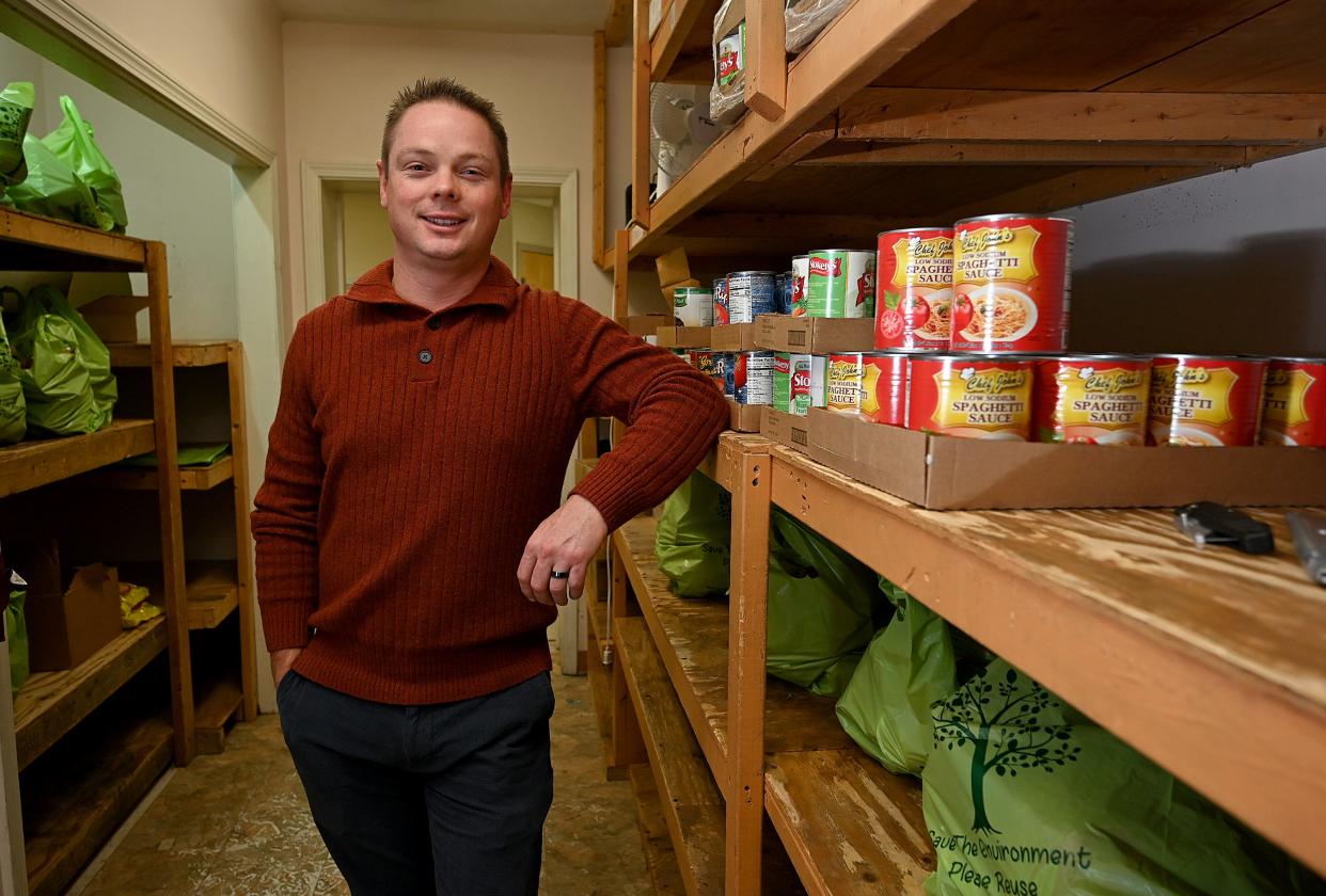 Joel Wallen at Pernet Family Health Service's food pantry, which is among the many Worcester organizations participating in the T&G Santa Fund.