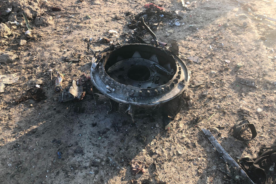 CORRECTS YEAR -  Debris is seen from a plane crash on the outskirts of Tehran, Iran, Wednesday, Jan. 8, 2020. A Ukrainian airplane carrying at least 170 people crashed on Wednesday shortly after takeoff from Tehran’s main airport, killing all onboard, state TV reported. (AP Photos/Mohammad Nasiri)