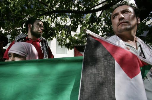 Chileans of Palestine descent hold a Palestinian flag during a protest in front of the Israeli Embassy in Santiago in 2008. In just over a century, Chile's Palestinian community has achieved things still not possible at home: a widespread rise to prosperity, elite status and even their own football team