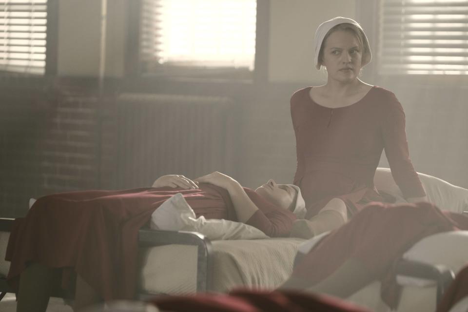 The Handmaid's Tale -- "Nolite Te Bastardes Carborundorum" Episode 104 -- Punished by Serena Joy, Offred begins to unravel and reflects on her time with Moira at the Red Center. A complication during the Ceremony threatens Offred’s survival with the Commander and Serena Joy. Offred (Elisabeth Moss), shown. (Photo by: George Kraychyk/Hulu)