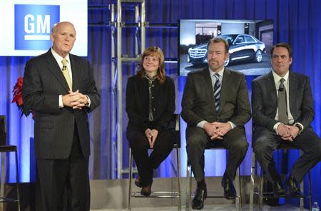 General Motors Chairman and CEO Dan Akerson (L) announces he is stepping during a Town Hall meeting with employees in Detroit, Michigan in this December 10, 2013 handout photo. Looking on are new CEO Mary Barra (2nd L), new GM President Dan Ammann, and new Executive Vice President, Global Product Development, Purchasing and Supply Chain Mark Reuss (R). REUTERS/Steve Fecht/General Motors/Handout via Reuters