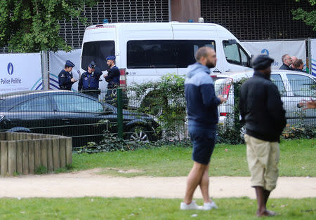 Police officers stand at the entrance of the Park Maximilien in Brussels, Belgium, September 17, 2018. REUTERS/Francois Walschaerts