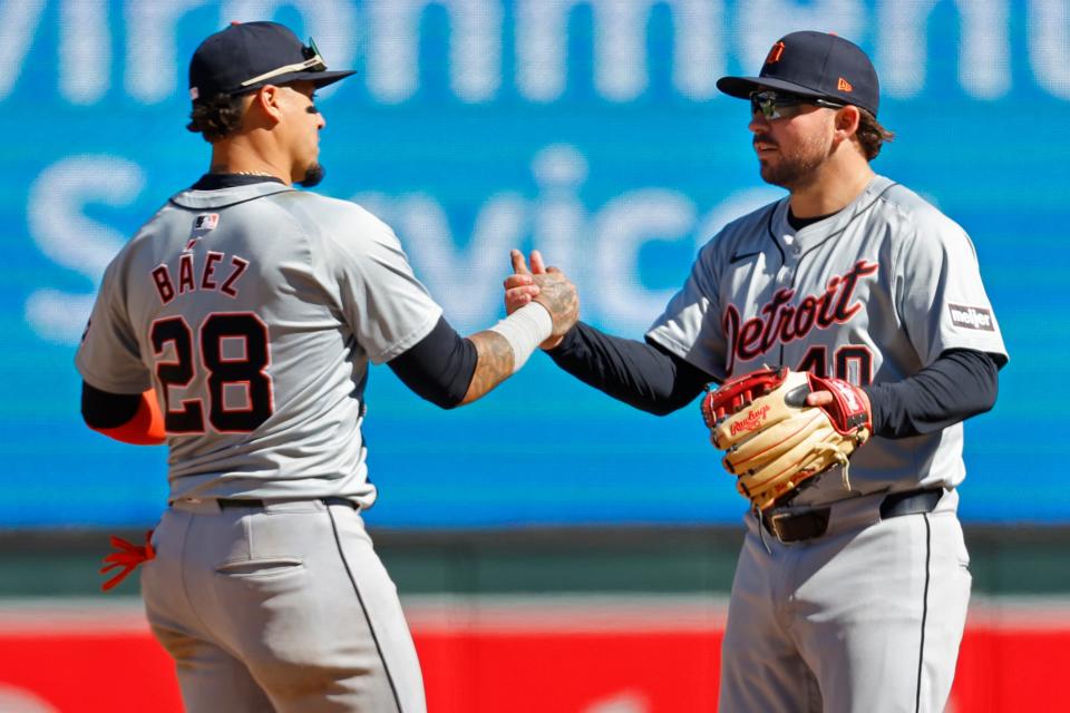 Detroit Tigers shortstop Javier Baez and second baseman Buddy Kennedy celebrate the win over the Minnesota Twins at Target Field on Sunday, April 21, 2024, in Minneapolis, Minnesota.