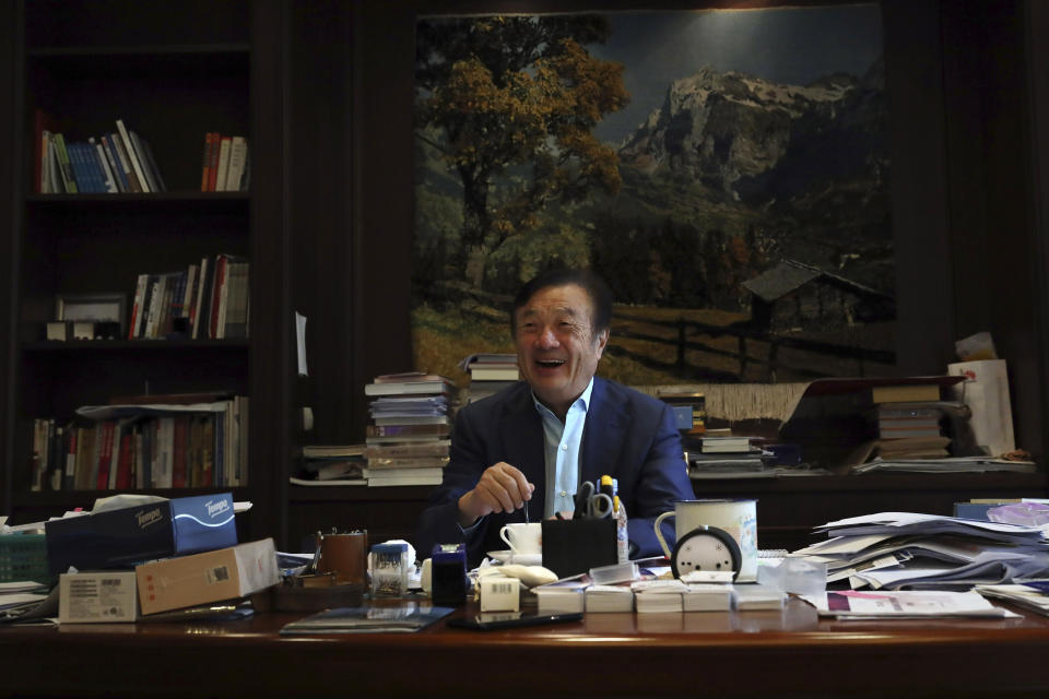In this Aug. 20, 2019, photo, Huawei's founder Ren Zhengfei stirs his coffee as he reacts to visitors at his office on the Huawei campus in Shenzhen in Southern China's Guangdong province. Ren says its troubles with President Donald Trump are hardly the biggest crisis he has faced while working his way from rural poverty to the helm of China’s first global tech brand. (AP Photo/Ng Han Guan)