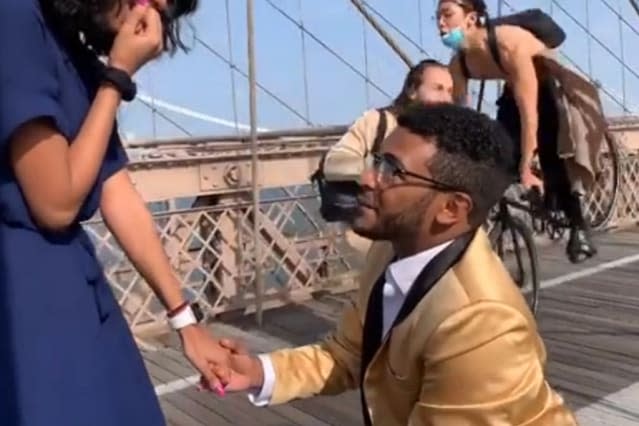 Proposal on Brooklyn Bridge interrupted after cyclist crashes into photographer