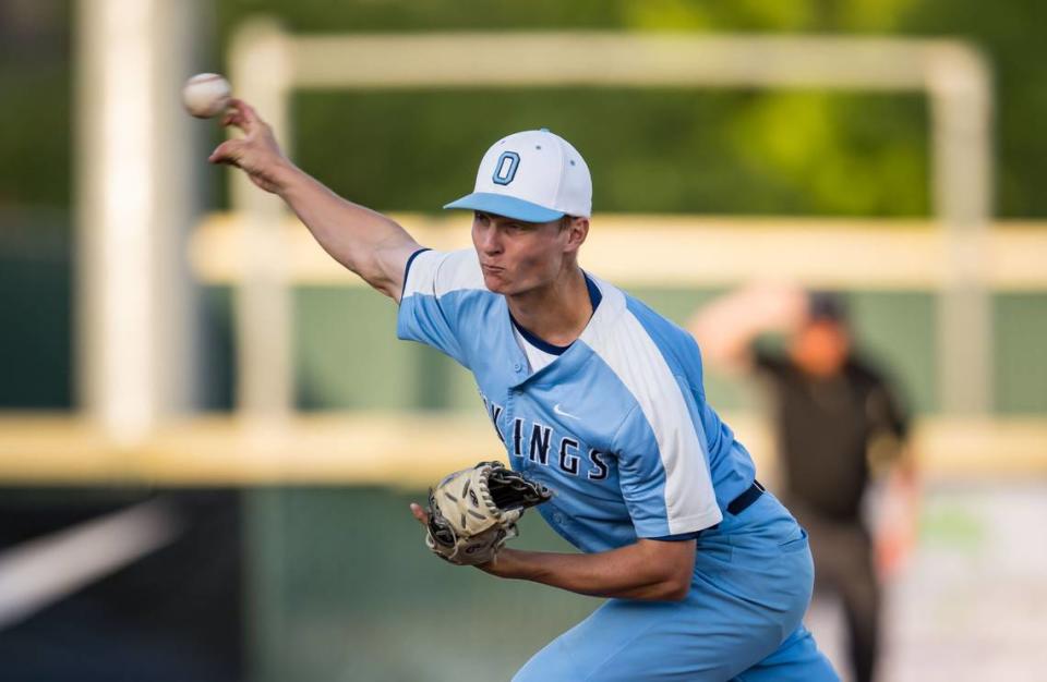 Oakmont Vikings pitcher Kurt Marton (2) throws against Woodland Wolves batter Aidan Olsen (21) during the bottom of the fifth inning of the CIF Sac-Joaquin Section Division IV high school baseball championship game Wednesday, May 24, 2023, at Sacramento City College. Oakmont beat Woodland, 10-0, for the section title.