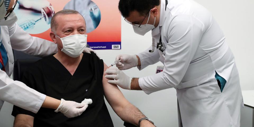 ANKARA, Jan. 14, 2021 -- Turkish President Recep Tayyip Erdogan C receives a dose of COVID-19 vaccine at a hospital in Ankara, Turkey, on Jan. 14, 2021. Erdogan on Thursday received his first dose of vaccine as Turkey has started mass vaccination against COVID-19. (Photo by Xinhua via Getty) (Xinhua/Xinhua via Getty Images)