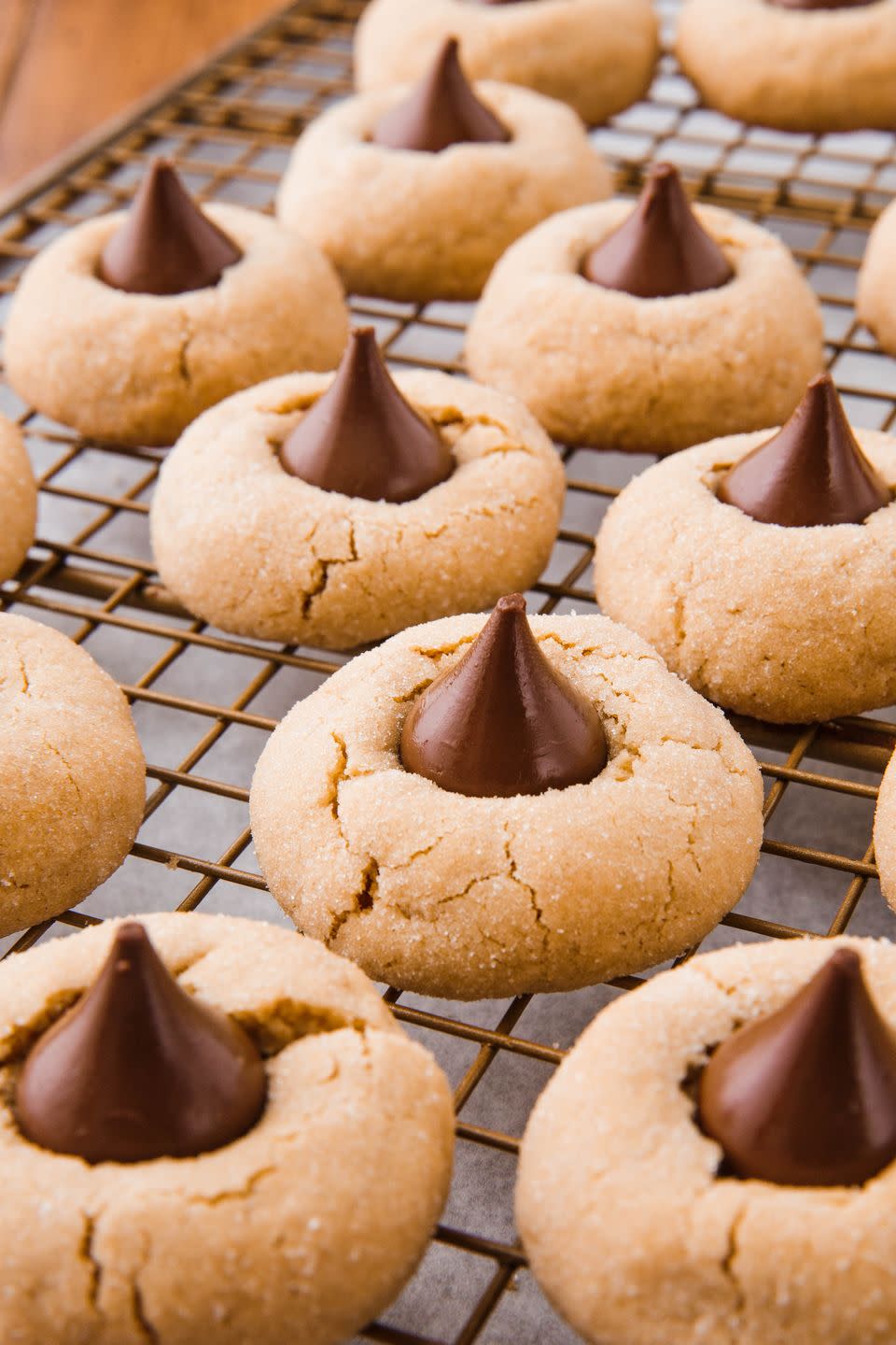 <p>Steal some Hershey kisses from the candy jar and put 'em in your cookies.</p><p>Get the recipe from <a href="https://www.delish.com/cooking/recipe-ideas/a24883952/peanut-butter-blossoms-recipe/" rel="nofollow noopener" target="_blank" data-ylk="slk:Delish;elm:context_link;itc:0;sec:content-canvas" class="link ">Delish</a>. </p>