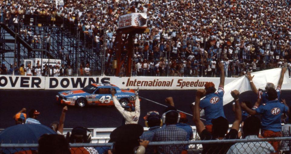 DOVER, DE - MAY 20, 1984: Richard Petty takes the checkered flag to score the victory in the Budweiser 500 NASCAR Cup race at Dover Downs International Raceway. (Photo by ISC Images & Archives via Getty Images)