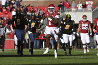 Arkansas quarterback KJ Jefferson (1) breaks through the Missouri defense as he runs for a big gain during the first half of an NCAA college football game Friday, Nov. 26, 2021, in Fayetteville, Ark. (AP Photo/Michael Woods)