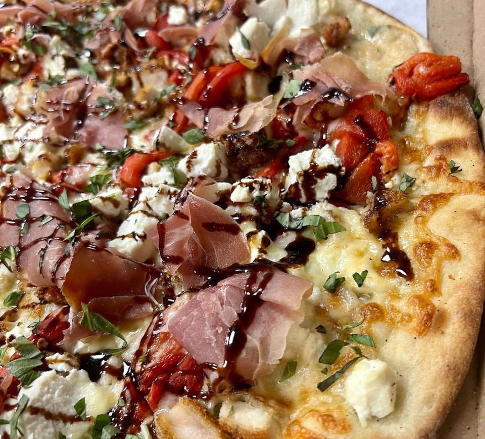 A Sexy Italian Pie, which is a white pie with prosciutto, freshly breaded chicken cutlets, roasted red peppers, ricotta, basil and balsamic glaze, from Tramonto's Pizza in Ocean Township.