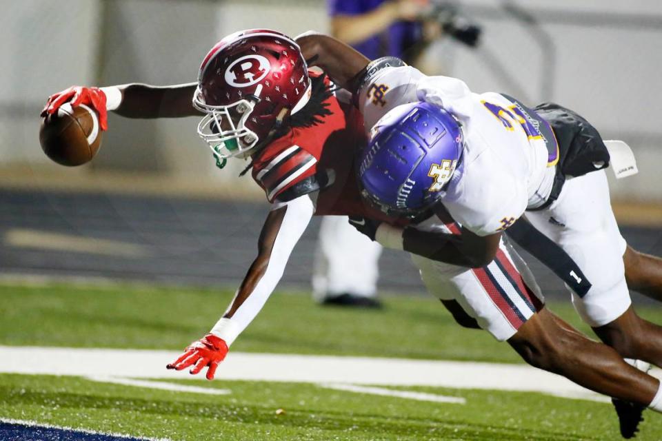 Warner Robins’ Cam Flowers (1) reaches for his second receiving touchdown in the first quarter of the Demons’ game against Jones County Friday night.