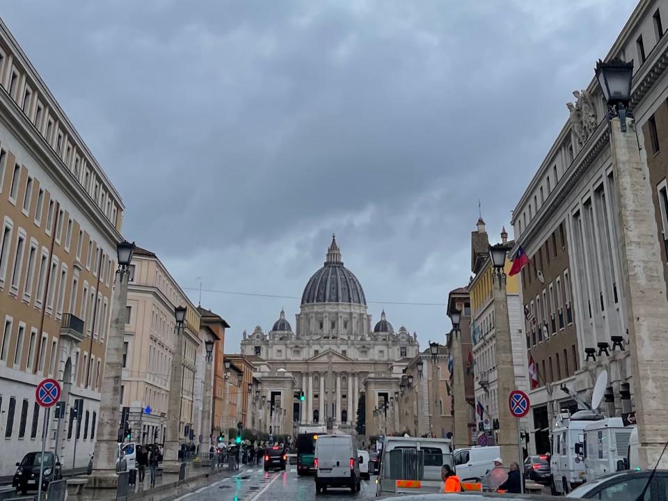 view of st peters in the vatican from down the street in italy