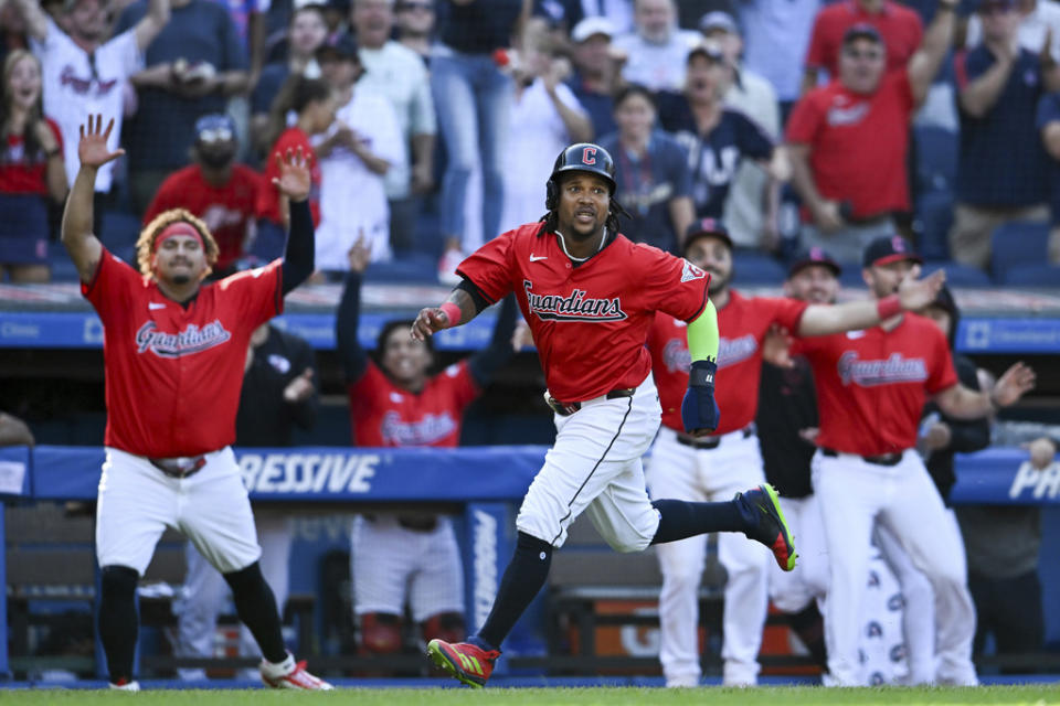 Cleveland Guardians’ José Ramírez scores on a walk off RBI single hit by Andrés Giménez to defeat the Minnesota Twins 3-2 in 10 innings in a baseball game, Thursday, Sept. 19, 2024, in Cleveland. (AP Photo/Nick Cammett)