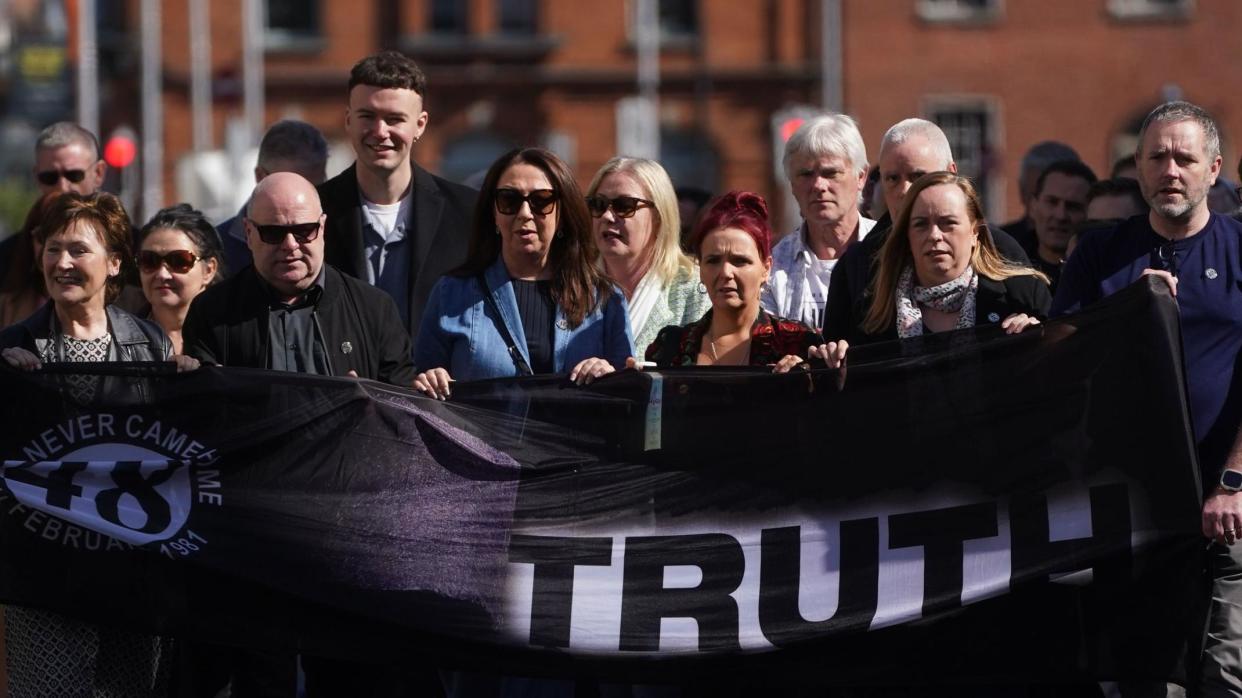 Stardust families marching in Dublin holding Truth banner
