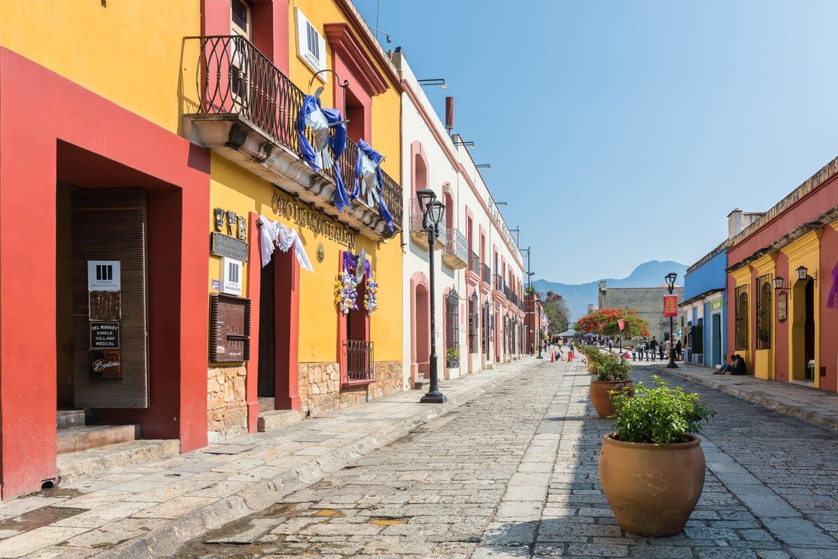 A colourful, low-rise street typical of Oaxaca, Mexico (Getty Images)