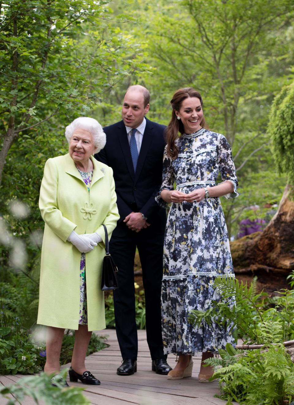 Britain's Catherine, Duchess of Cambridge (R) shows Britain's Queen Elizabeth II (L) and Britain's Prince William, Duke of Cambridge, around the 'Back to Nature Garden' garden, that she designed along with Andree Davies and Adam White, during their visit to the 2019 RHS Chelsea Flower Show in London on May 20, 2019. - The Chelsea flower show is held annually in the grounds of the Royal Hospital Chelsea. (Photo by Geoff Pugh / POOL / AFP)        (Photo credit should read GEOFF PUGH/AFP via Getty Images)