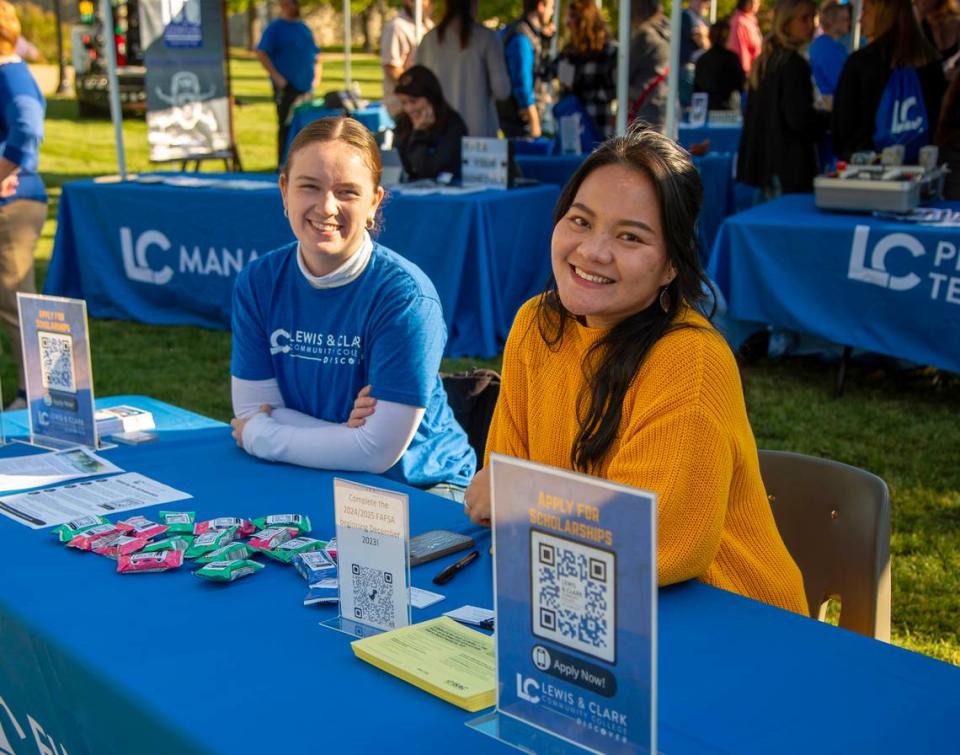 L&C Scholarship Coordinator Cora Gray and Financial Aid Associate Emily Nguyen welcome students at the Fall 2023 Discover Day event. Provided