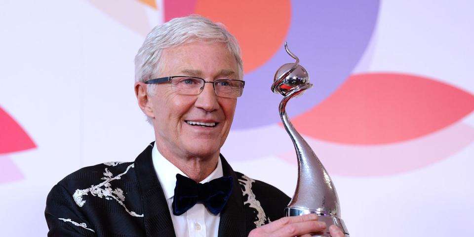 paul o'grady smiles as he holds his ntas trophy at the 2019 ceremony