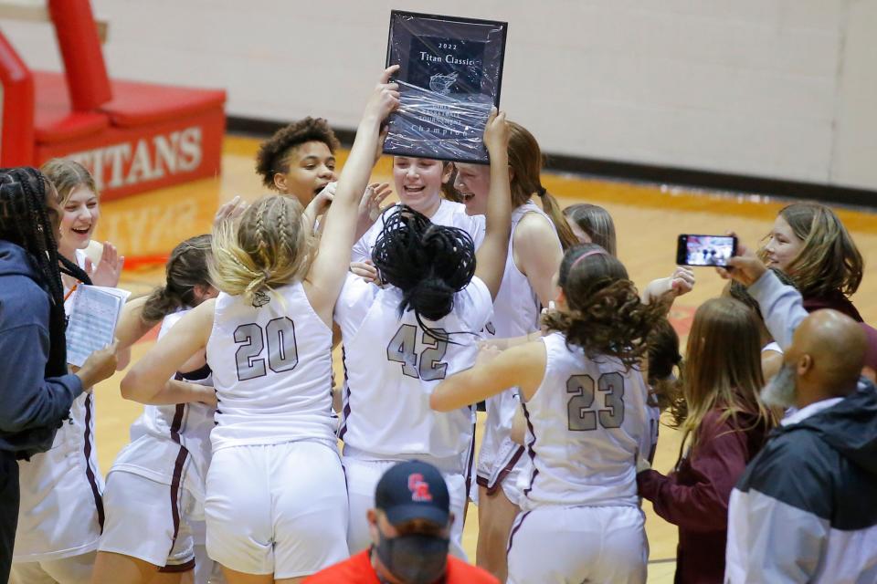 Edmond Memorial celebrates after their win over Carl Albert in the girls championship game of the Titan Classic basketball tournament at Carl Albert, Saturday, Jan. 22, 2022. 