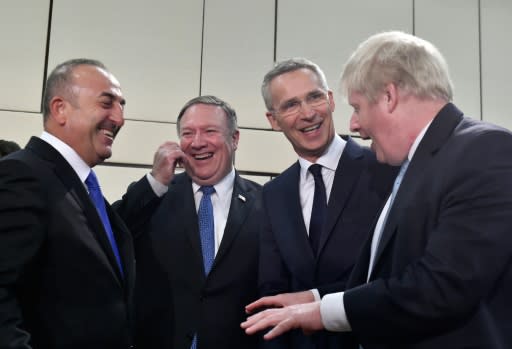 Turkey's Foreign Affairs minister Mevlut Cavusoglu, US Secretary of State Mike Pompeo, NATO Secretary General Jens Stoltenberg and British Foreign Secretary Boris Johnson share a joke before the opening of a Foreign ministers meeting in Brussels