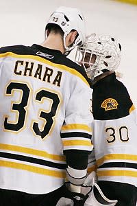 Zdeno Chara and Tim Thomas put their heads together for a victory in Tampa
