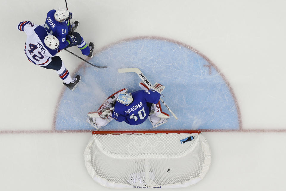 USA forward David Backes (42) watches his goal sail into the net past Slovenia goaltender Luka Gracnar (40) during the 2014 Winter Olympics men's ice hockey game at Shayba Arena Sunday, Feb. 16, 2014, in Sochi, Russia. (AP Photo/Matt Slocum)