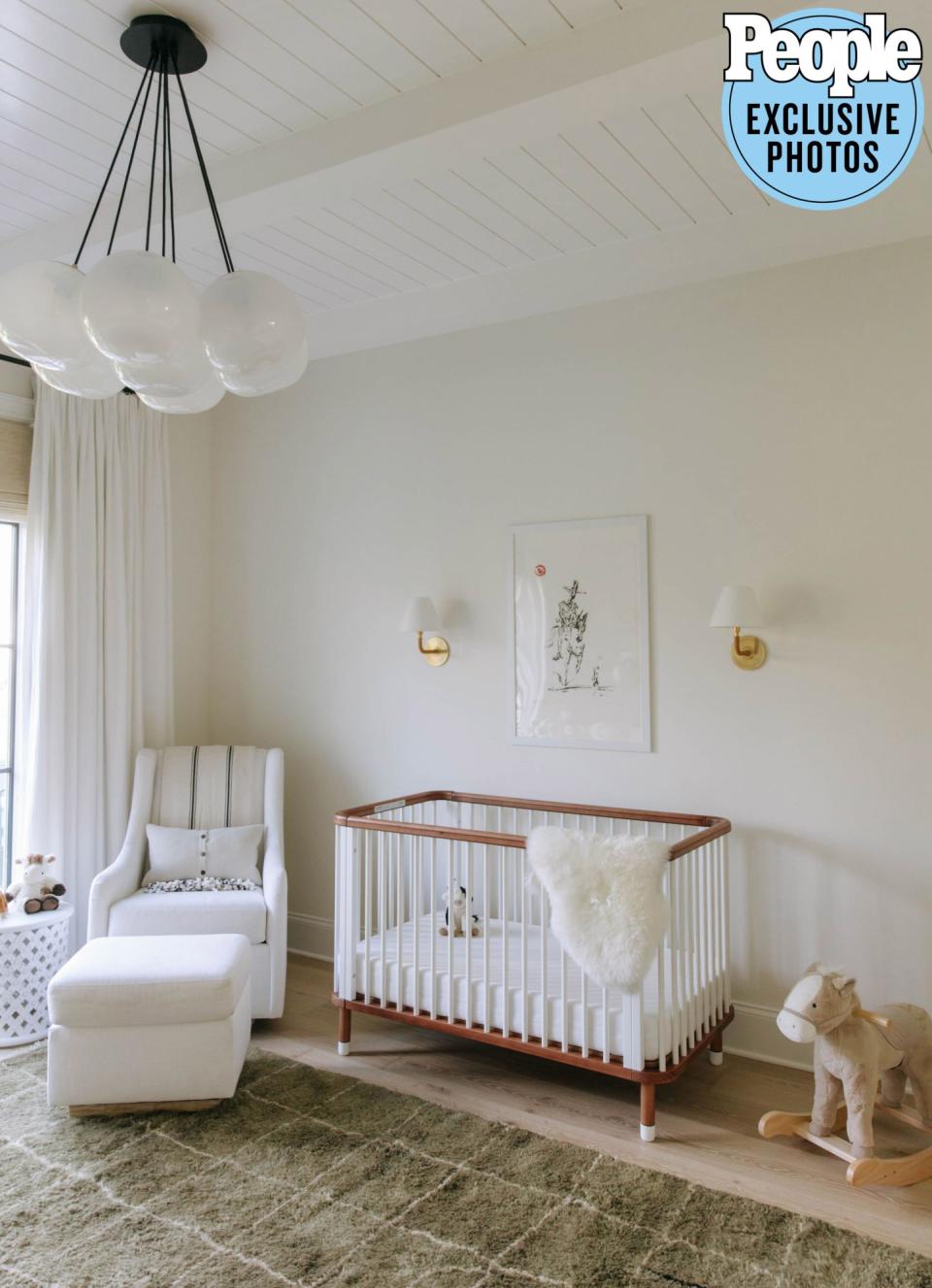 <p>Rather than starting from scratch on a nursery for their newborn, the couple instead chose to finish Dutton's toddler bedroom and then update his existing nursery for Baker. "We added some new accents [including art by <a href="https://www.instagram.com/chriscolemanart/" rel="nofollow noopener" target="_blank" data-ylk="slk:Chris Coleman;elm:context_link;itc:0;sec:content-canvas" class="link ">Chris Coleman</a>] and a new crib [by <a href="https://www.nestig.com/collections/cribs" rel="nofollow noopener" target="_blank" data-ylk="slk:Nestig;elm:context_link;itc:0;sec:content-canvas" class="link ">Nestig</a>] to switch it up," Lauren, 32, explained. </p>