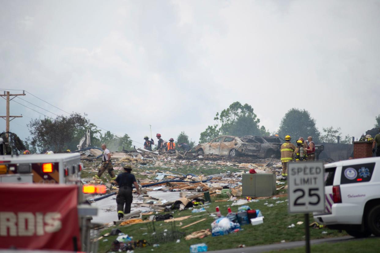 Police and emergency services search the wreckage of the three houses that exploded near Rustic Ridge Drive and Brookside Drive in Plum, Pa., on last Saturday.