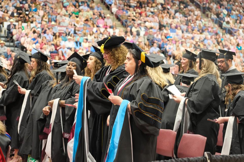 Graduates await their turn to walk the stage Saturday at the WT Commencement Ceremony in Canyon.