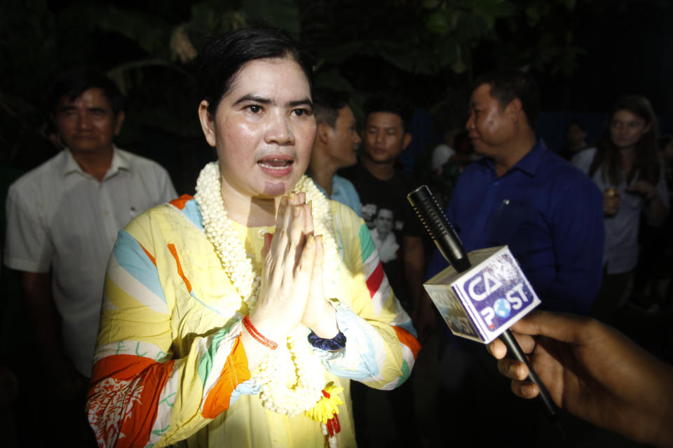 A prominent leader of Cambodia's land rights activist Tep Vanny, upon arrival at her home in Boeung Kak, in Phnom Penh, Cambodia, Monday, Aug. 20, 2018. A prominent leader of Cambodia's land rights movement and three women activists who were sent to prison with her were freed Monday under a royal pardon. (AP Photo/Heng Sinith)