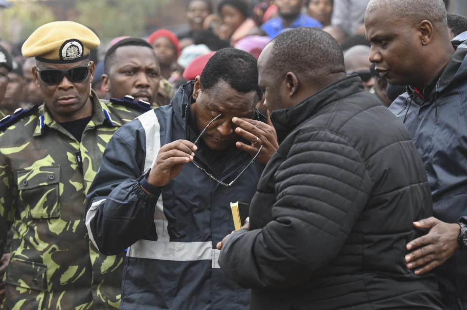 Malawi's president Lazarus Chakwera, weeps as he attends the burial ceremony for some of the people who lost their lives following heavy rains caused by Cyclone Freddy, in Blantyre southern Malawi, Wednesday, March 15, 2023. After barreling through Mozambique and Malawi since late last week and killing hundreds and displacing thousands more, the cyclone is set to move away from land bringing some relief to regions who have been ravaged by torrential rain and powerful winds. AP Photo/Thoko Chikondi)