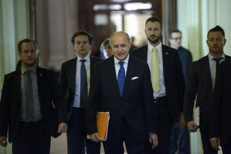 French Foreign Minister Laurent Fabius (C) pictured during a break in a meeting with world representatives seeking to pin down a nuclear deal with Iran on March 31, 2015 in Lausanne