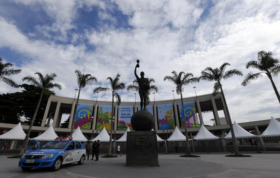 The main entrance of Maracana stadium is pictured before a press visit in Rio de Janeiro. While it was undergoing renovation, visitors of the stadium were able to take away a piece of the old stadium as a souvenir. (Sergio Moraes/Reuters)