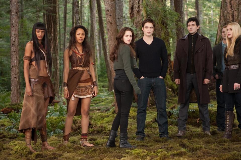 FILE- This undated file photo provided by Summit Entertainment shows, from left, Judith Shekoni, Tracey Heggins, Kristen Stewart, Robert Pattinson, Christian Camargo, Peter Facinelli and Casey LaBow in a scene from the film "The Twilight Saga: Breaking Dawn - Part 2." The finale to the blockbuster supernatural romance dominated the 33rd Annual Razzie Awards on Saturday, Feb. 23, 2013 with seven awards, including worst actress for Kristen Stewart, supporting actor for Taylor Lautner, director for Bill Condon and worst screen couple for Lautner and child co-star Mackenzie Foy. (AP Photo/Summit Entertainment, Andrew Cooper, SMPSP, File)