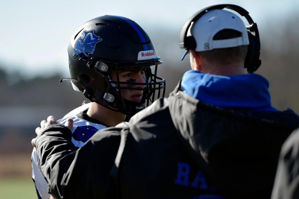 Dover-Sherborn junior quarterback Garrett Webb talks with Dover-Sherborn head coach Steve Ryan in between plays during the Division 5 Final Four game against Shawsheen in Weston, Nov. 19, 2022. The Rams defeated the Raiders, 21-14.