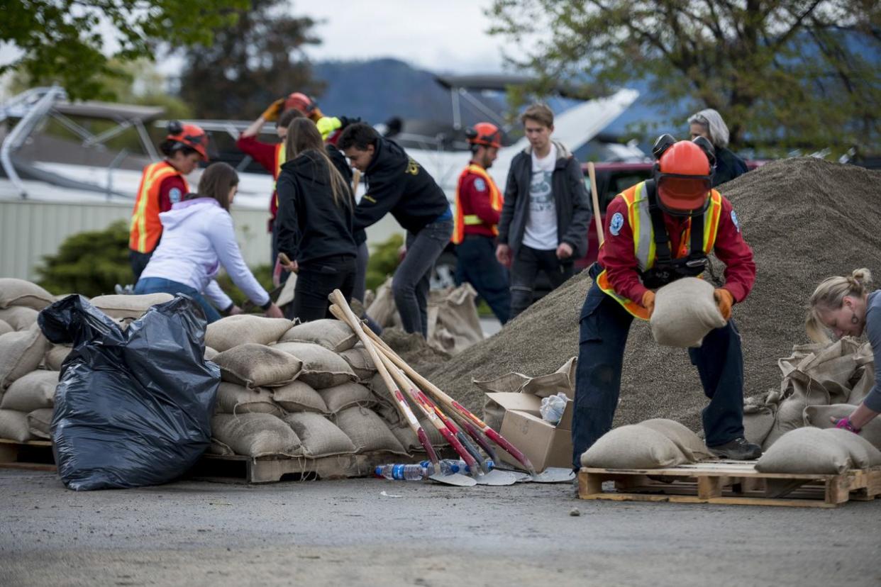 emergency response worker piling sandbags