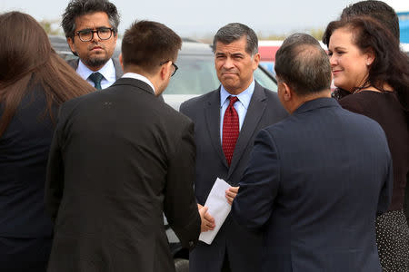 Attorney General of California Xavier Becerra meets with his staff at the U.S.-Mexico border prior to announcing a lawsuit against the Trump Administration over its plans to begin construction of border wall in San Diego and Imperial Counties, in San Diego, California, U.S., September 20, 2017. REUTERS/Mike Blake