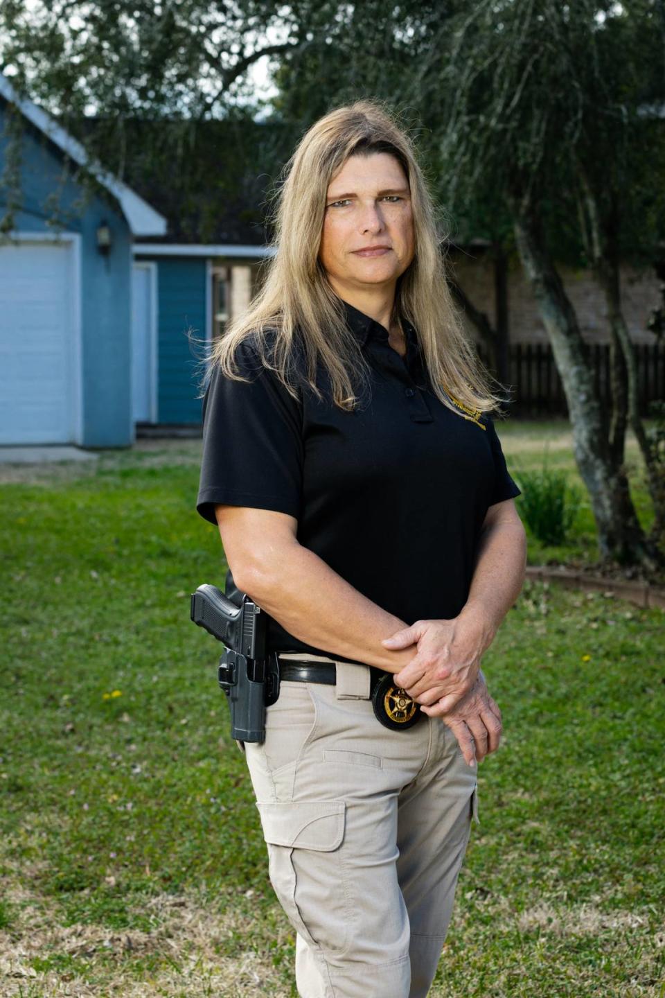 Houston County Sgt. Anna Lange outside her home. Lange sought at exclusion to the county’s health insurance policy to cover surgeries needed to make her body align with her gender. County leaders refused, and spent $1 million in court fighting Lange.