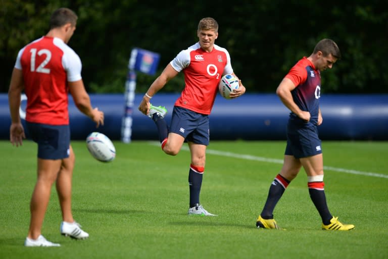 England's Owen Farrell (C), Sam Burgess (L) and George Ford attend a training session at the Pennyhill Park training ground on August 26, 2015