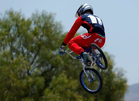 U.S. Olympic athlete Connor Fields goes off a jump as he works out on his BMX bike at the Olympic Training Center in Chula Vista, California, United States, July 1, 2016. REUTERS/Mike Blake