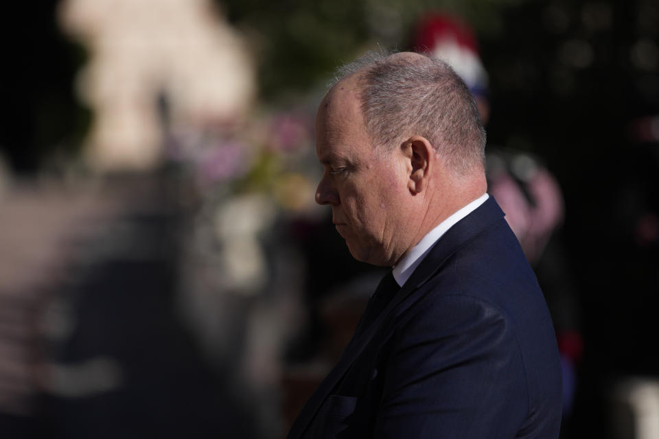 Prince Albert II of Monaco stands during a minute of silence during a ceremony honoring Joesphine Baker at the Monaco-Louis II Cemetery in Monaco, Monday, Nov. 29, 2021. France is inducting Missouri-born cabaret dancer Josephine Baker who was also a French World War II spy and civil rights activist into its Pantheon. She is the first Black woman honored in the final resting place of France’s most revered luminaries. A coffin carrying soils from places where Baker made her mark will be deposited Tuesday inside the domed Pantheon monument overlooking the Left Bank of Paris. (AP Photo/Daniel Cole)