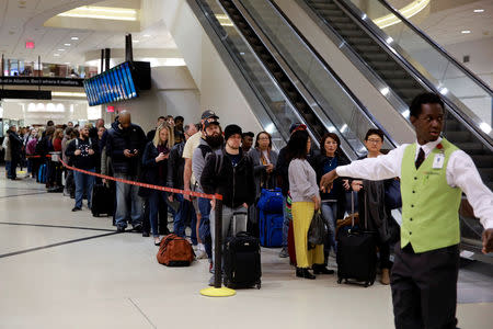 A line of passengers waiting to pass through the main Transportation Security Administration (TSA) security checkpoint is seen at Hartsfield-Jackson Atlanta International Airport amid the partial federal government shutdown, in Atlanta, Georgia, U.S., January 18, 2019. REUTERS/Elijah Nouvelage