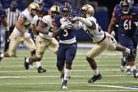 UTSA's Sincere McCormick (3) evades Army's Marquel Broughton during an NCAA college football game on Saturday, Oct. 17, 2020, in San Antonio, Texas. (AP Photo/Darren Abate)