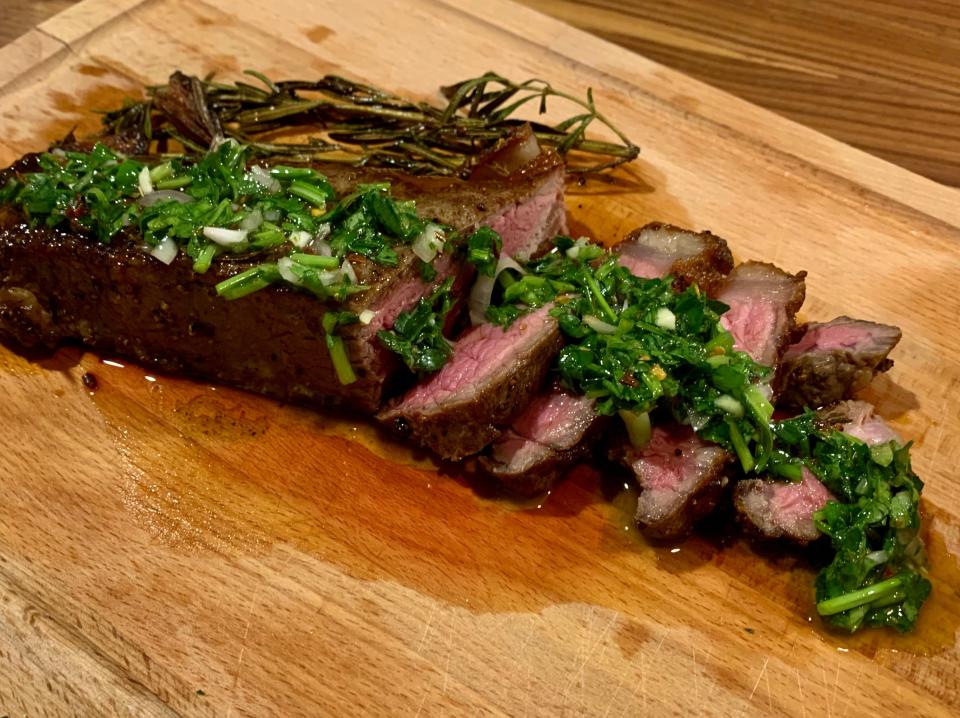 steak on cutting board with chimichuri