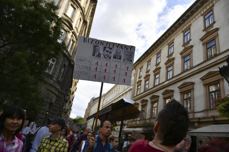 The banner gives "the worst grade to politicians in empathy, toleration and cooperation". Hungarian students protest in solidarity with their teachers in front of the St. Stephen's Basilica in Budapest, Hungary, Friday, Sept. 2, 2022. Public schools in Poland and Hungary are facing a shortage of teachers at a time when both countries are taking in many Ukrainian refugee children. For years, teachers have been fleeing public schools over grievances regarding low wages and a sense of not being valued by their governments. (AP Photo/Anna Szilagyi)